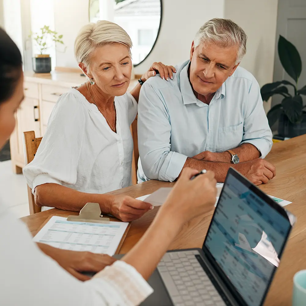 older couple talking with person on a laptop