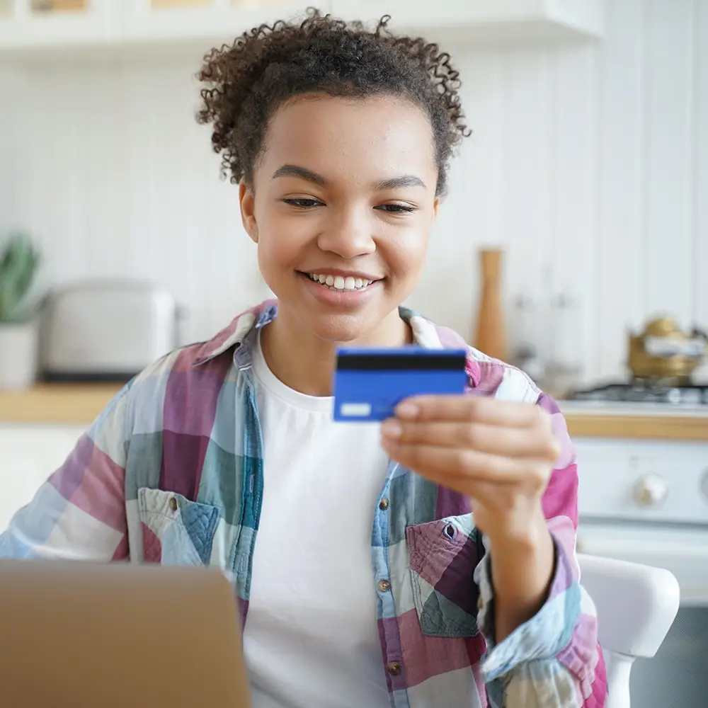 young girl with credit card