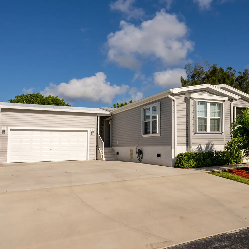 couple in front of home with soalr panels